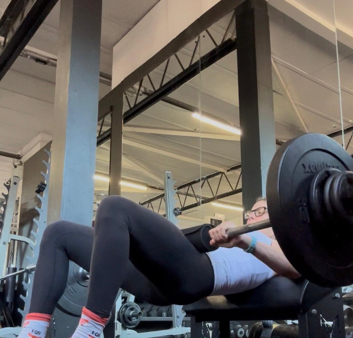 Chloe Willis performing a hip thrust exercise